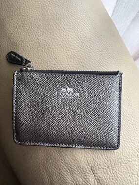 Coach women’s metallic key card holder.